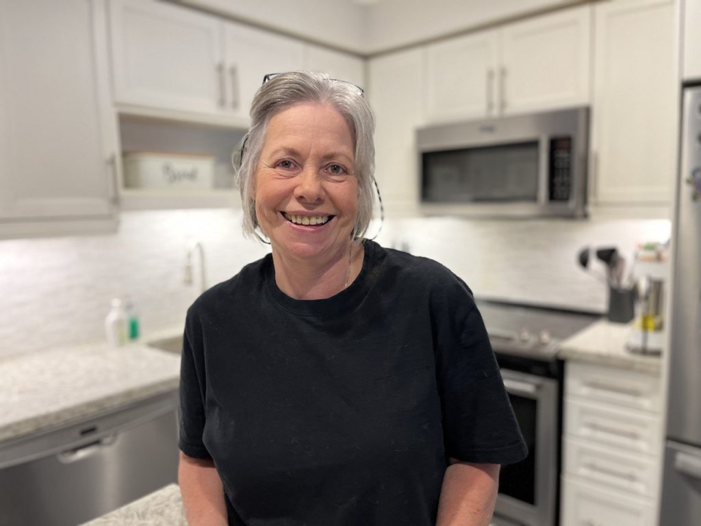 Mery Sparkle Cleaners owner black t-shirt smiling